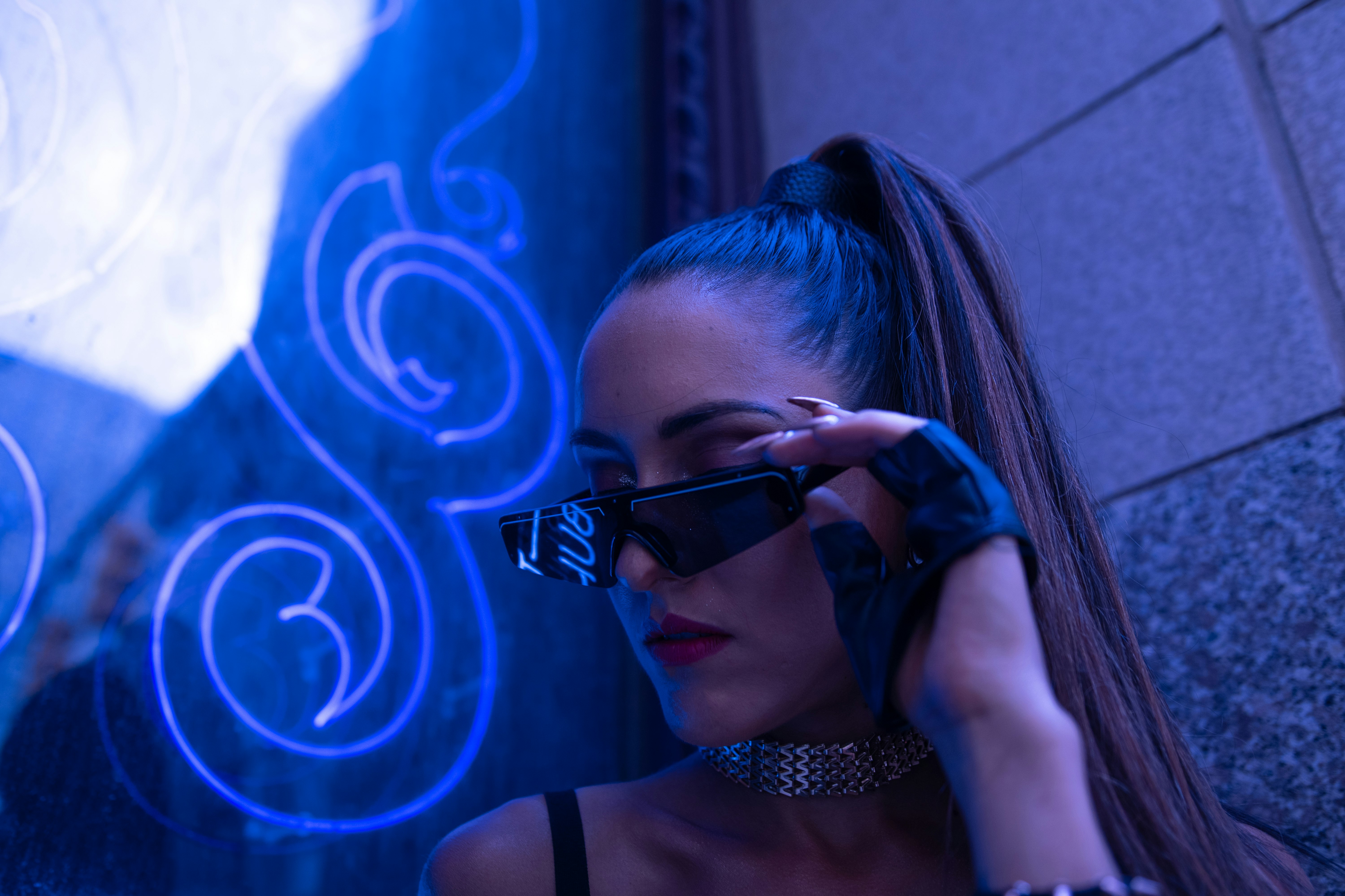 woman in black tank top wearing black sunglasses